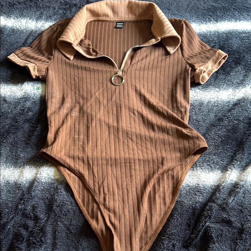 Brown Ribbed once piece with silver zipper and collar